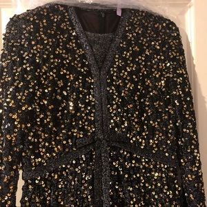 Vintage black and gold sequins dress. Long. Flowy on bottom.
